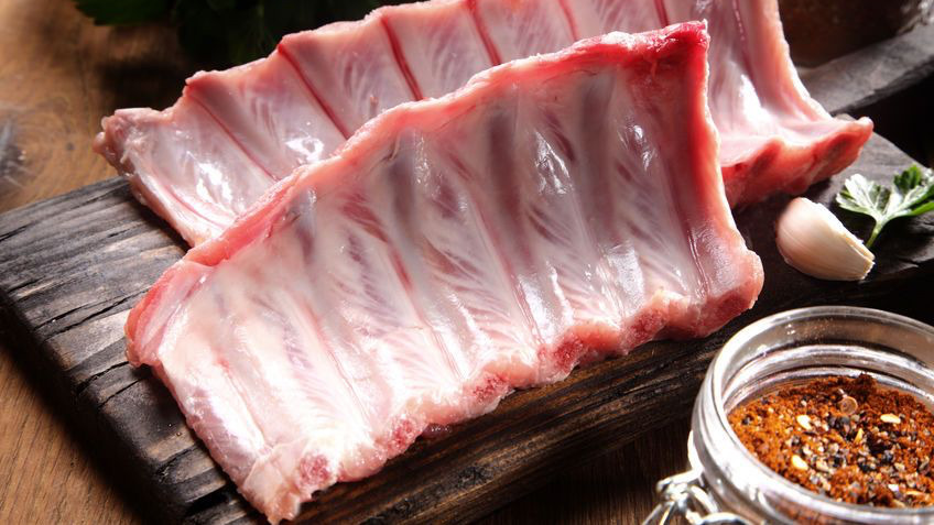 Raw Pork Rib Meat on Wooden Cutting Board